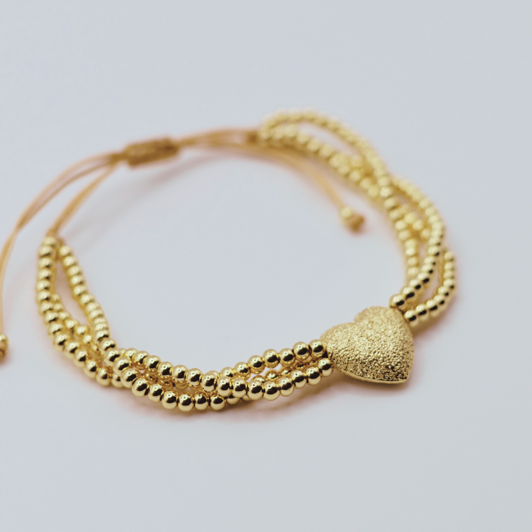 Pulsera balines corazón dorado