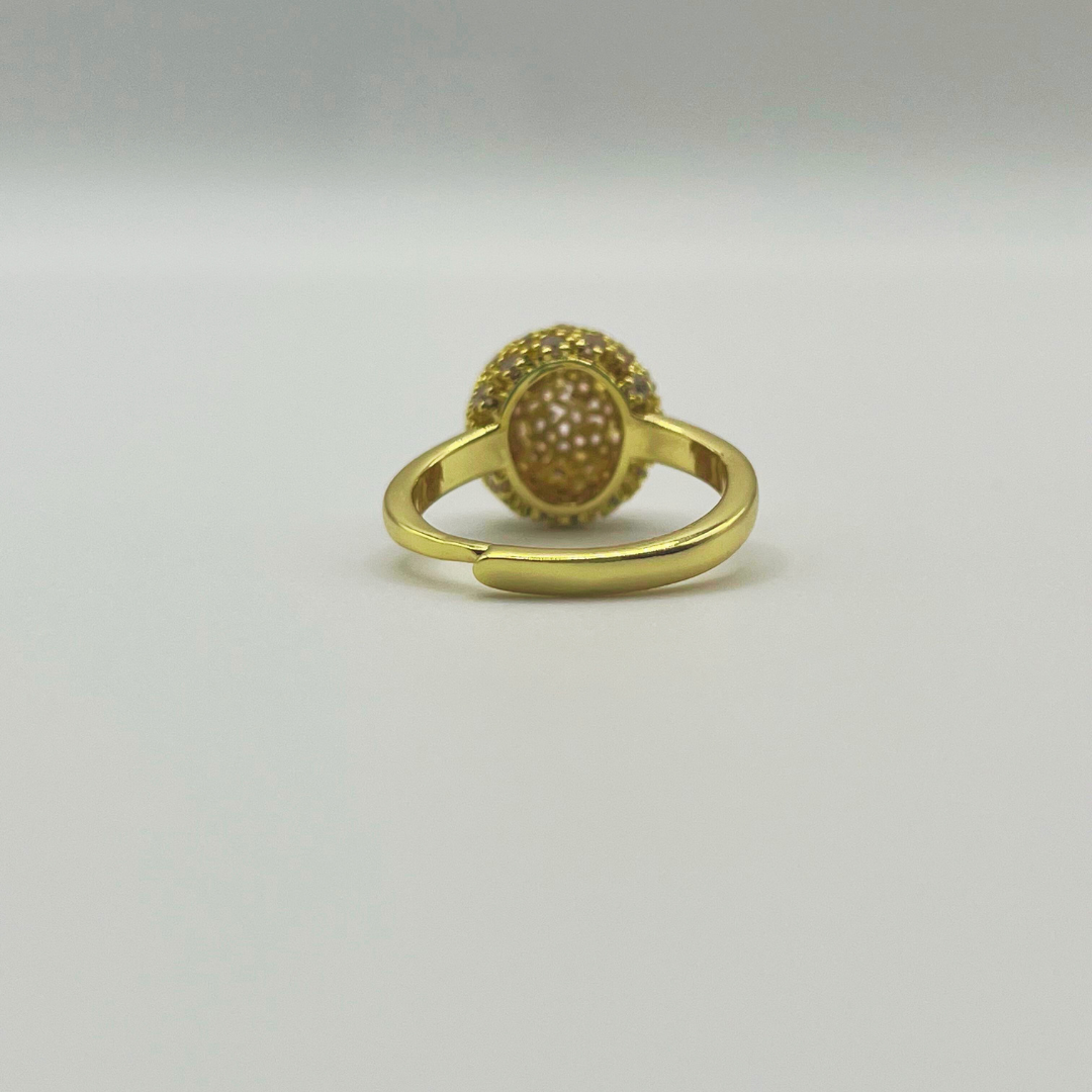 Anillo bolita con zircones dorado